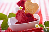 Strawberry sorbet with heart-shaped wafer
