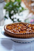 Mirabelle tart on cake stand