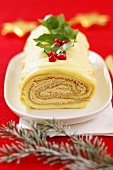 Sponge roll with coffee cream filling and white chocolate (Christmas)