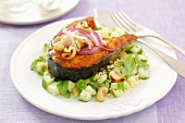 Salmon steak with couscous salad and cashew nuts