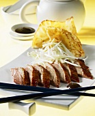 Peking duck with spring onions and pancakes