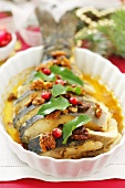 Baked carp with nuts and honey sauce (Christmas)
