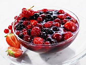 Red berry compote in a glass dish