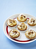 Several banoffee tarts on plate