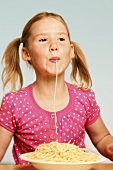Girl eating spaghetti