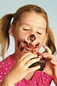 Girl eating chocolate cake