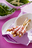 Grissini e prosciutto (Bread sticks wrapped in Parma ham)