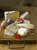 Various cheeses, redcurrants and figs