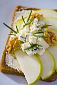 Pear slices, blue cheese and walnuts on wholemeal bread