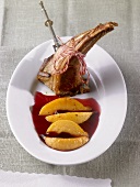 Rack of lamb with quince quarters in redcurrant jelly