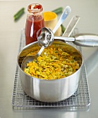 Vegetable ragout in pan with hand blender