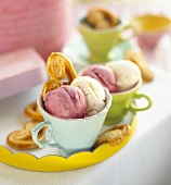 Berry and vanilla ice cream with palmiers in cups