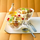 Pasta salad with tomatoes, mozzarella and pine nuts