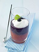 Layered berry smoothie with cream