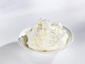 Whipped cream in a small dish