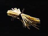 Spaghetti against a black background