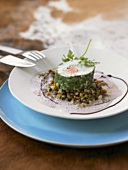 Turbot and salmon roulade in herb coating on mixed lentils