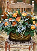 Arrangement of roses on a chair out of doors
