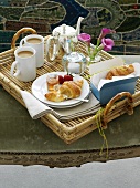 Breakfast tray (croissant, honey, coffee)