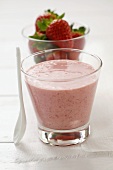 Strawberry smoothie and fresh strawberries