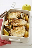 Pork chops with apple wedges and raisins