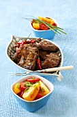 Grilled spare ribs with chillies and tomato salad