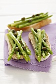 Crostini topped with green asparagus and capers