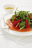 Smoked salmon with strawberries and rocket