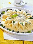 Pineapple & blueberry ice cream cake in shape of a sunflower
