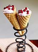 Cranberry ice cream in two waffle cones