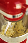 Making cake mixture in a red food mixer