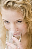 Young woman drinking mineral water