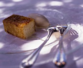 A piece of almond cake and almond ice cream