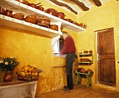 Man washing up in kitchen