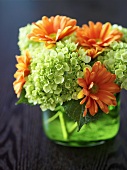 Hydrangeas and gerberas in glass vase