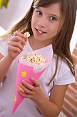 Girl eating popcorn