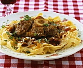 Ossobucco all'americana (Braised veal shank on pasta)