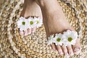 Flowers between someone's toes
