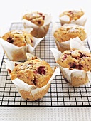 Raspberry muffins on cake rack