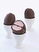 Home-made chocolate Easter eggs in eggcups