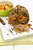 Rolled pork roast stuffed with dried apricots