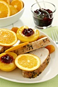 Turkey breast fillet, orange slices and stuffed peaches