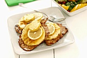 Pork escalopes with pineapple, lemon and butter