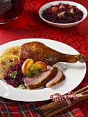 Roast goose leg with accompaniments for Christmas