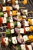 Cheese and vegetable kebabs on a barbecue