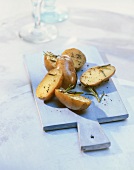 Rosemary potatoes on wooden board