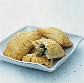 Spinach and feta pasties with sesame seeds