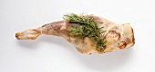 Raw leg of lamb with rosemary