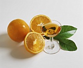 Still life with fresh oranges and orange liqueur