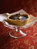 Chocolate tartlet with gold leaf
